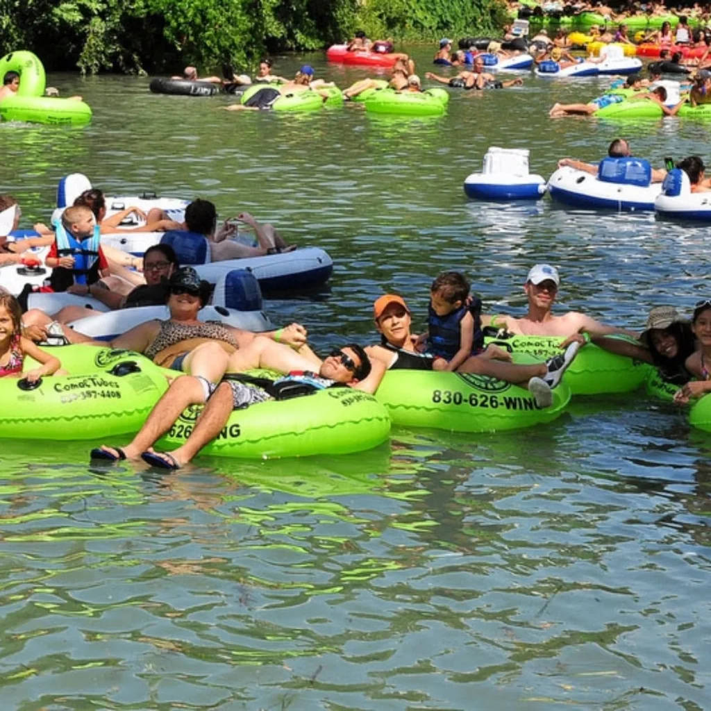 Families enjoying the calm current of the Comal River. Credit: @comaltubes via Instagram