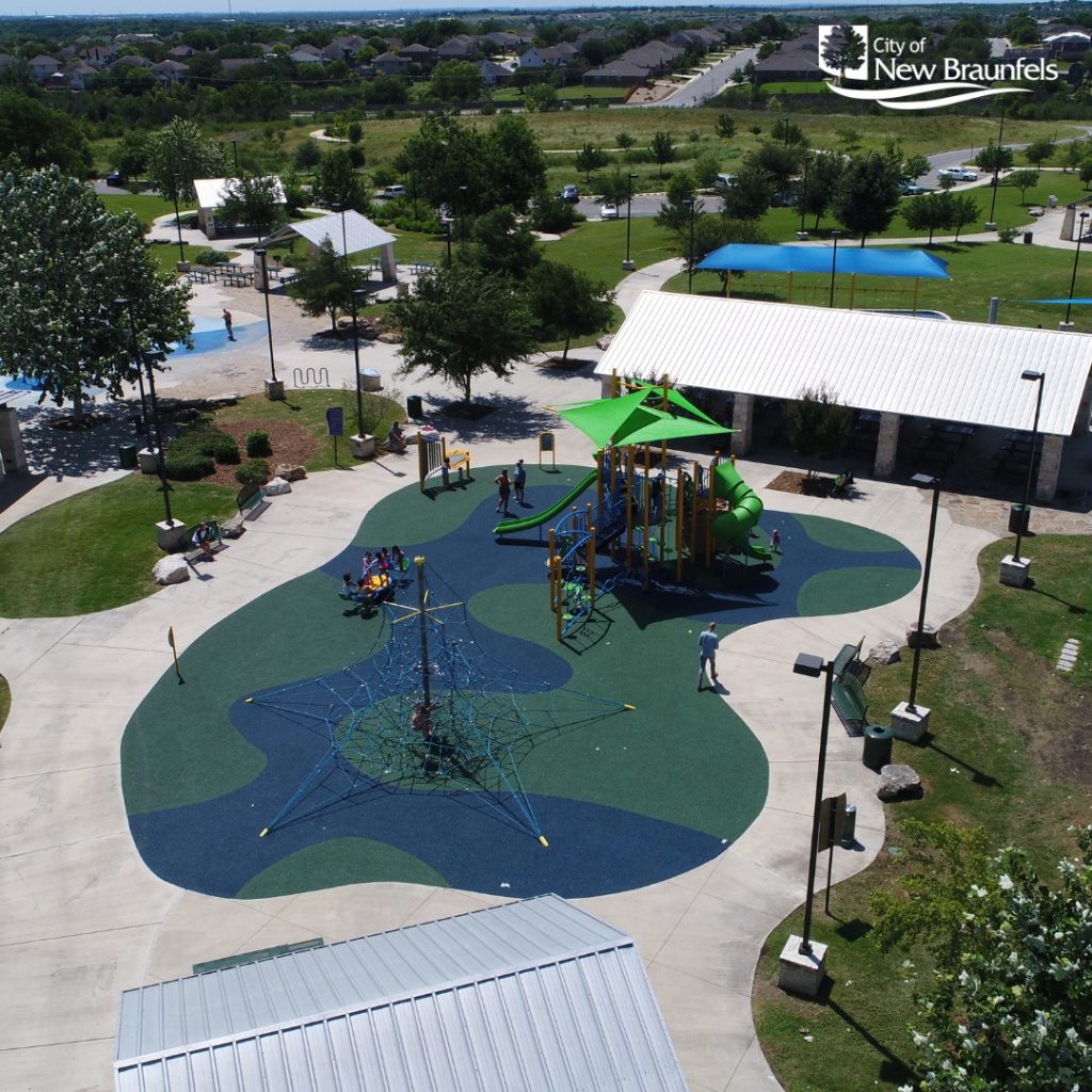An aerial view of Fischer Park, highlighting the playground where kids can run, climb, and play. Credit: @nbparksandrec via Instagram