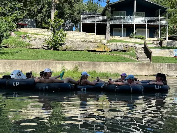 A group of friends is enjoying their time floating through the Guadalupe River. Credit: Tubing the Guadalupe River via Facebook