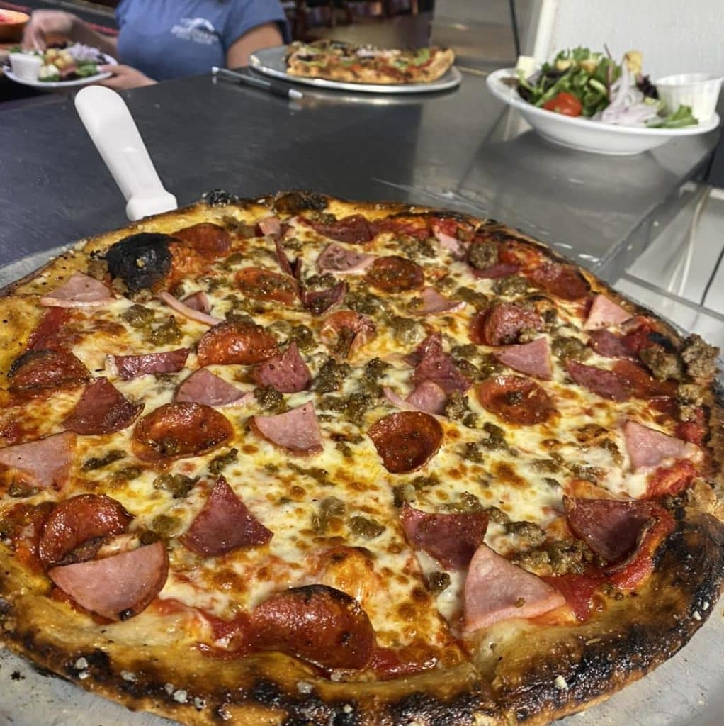 For meat lovers: a generously topped pizza from Bootleggers Pizza Parlor. Credit: @bootleggers_pizza_parlor via Instagram