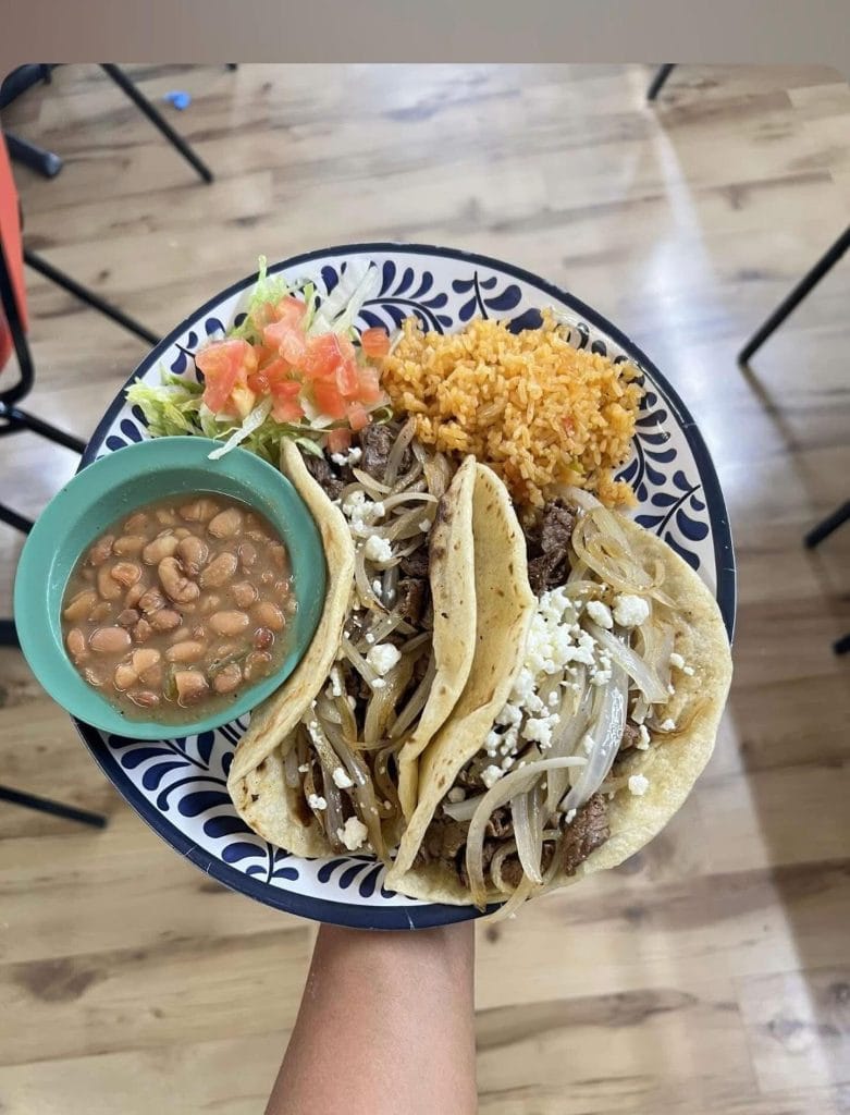 The Asado Taco plate at Butcher Boy Taco House comes complete with grilled onions, queso fresco, rice, charro beans, and a refreshing tea. Credit: @butcherboytacos via Instagram