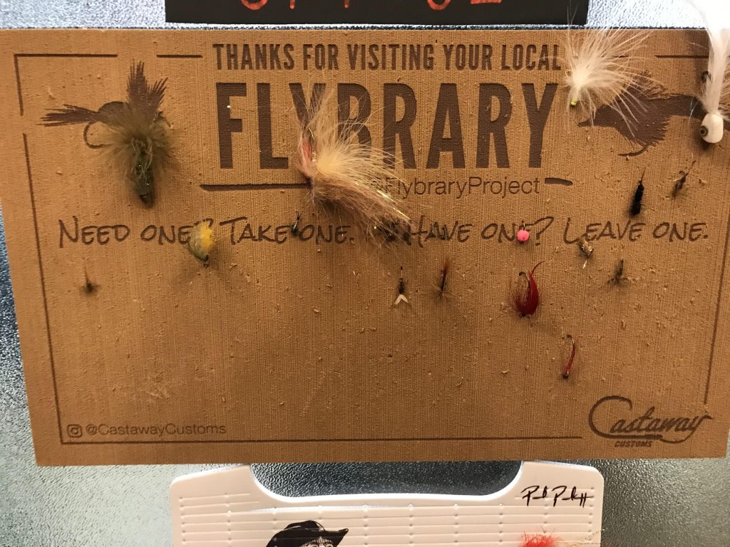 A community fly board: take one, leave one if you have extra. A small but meaningful tradition that keeps the fly-fishing camaraderie alive. Credit: u/garden_pedaler via r/flyfishing