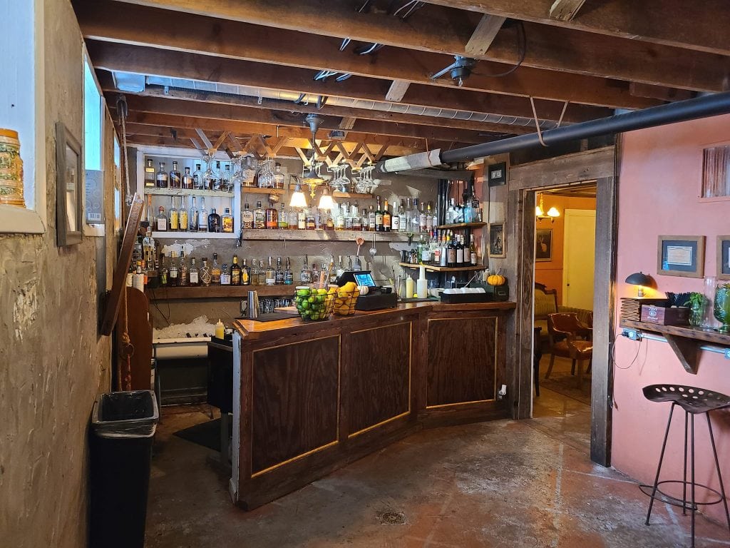 Step into The Grove’s underground speakeasy, where dim lighting and cozy vibes set the scene for craft cocktails. Credit: Matt Accardi via Facebook