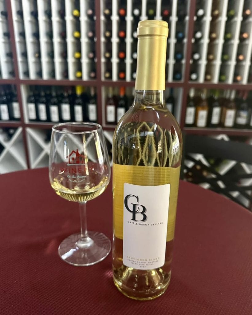 Wine tasting at Winery on the Gruene, surrounded by a huge selection of bottles to explore. Credit: @wineryonthegruene via Instagram