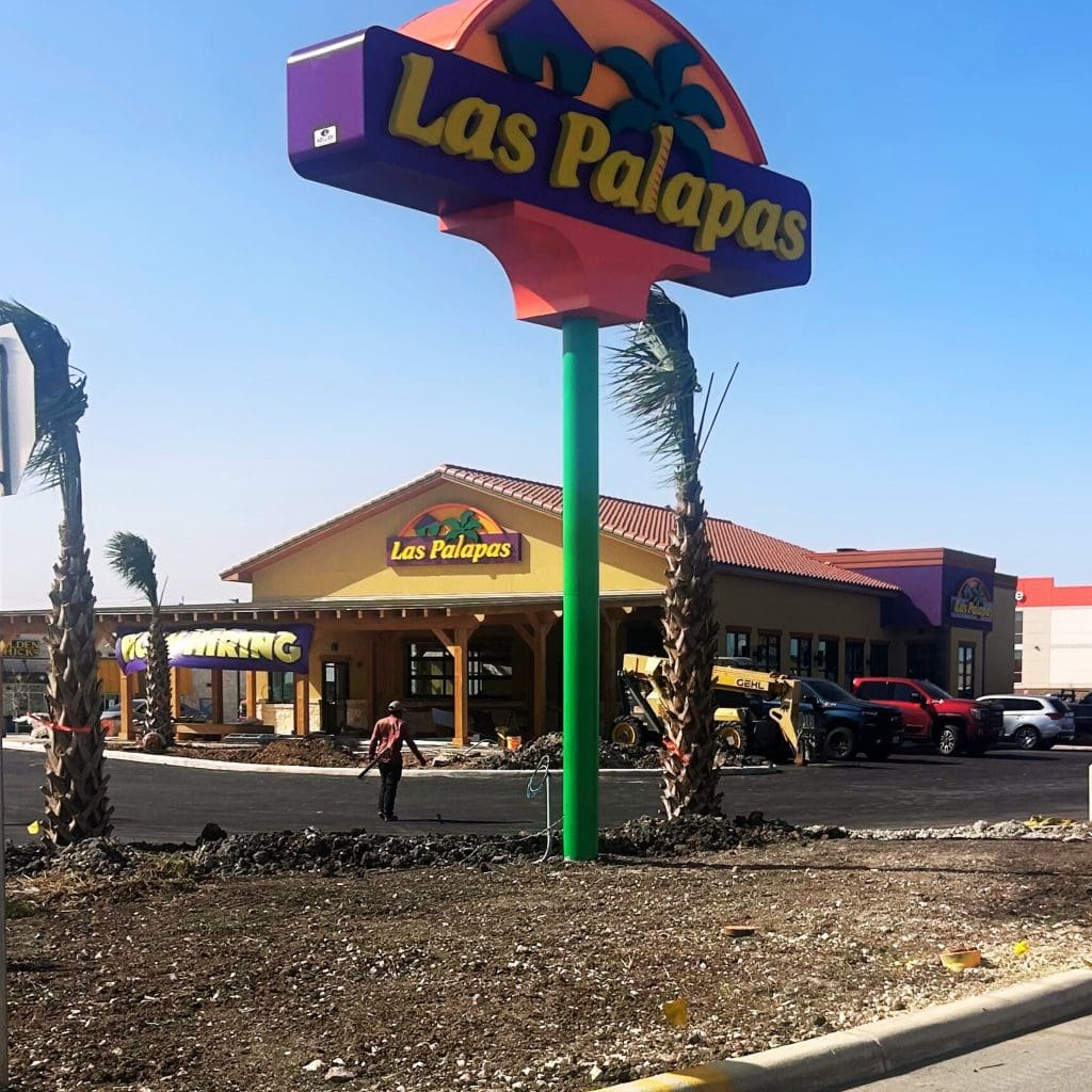 You can’t miss it! The bold, colorful road sign for Las Palapas stands out from the highway. Credit: @laspalapasrestaurants via Instagram