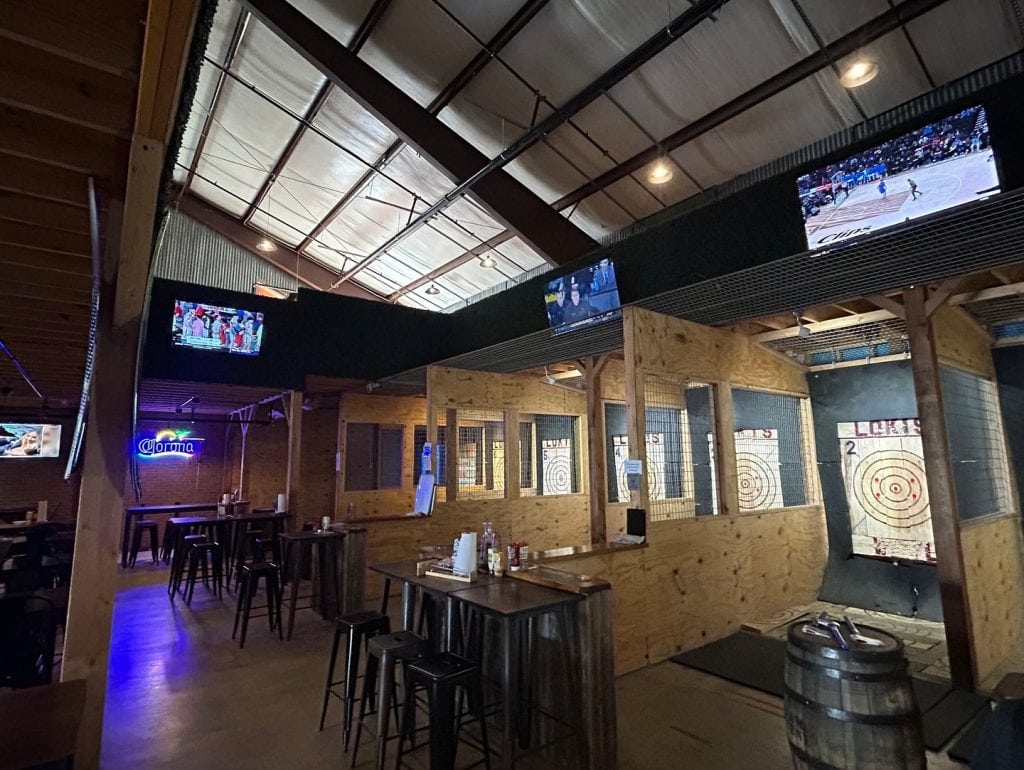 Loki’s Axe Haus combines dining and entertainment, offering meals alongside the thrill of axe throwing. Credit: @lokisaxehaus via Instagram
