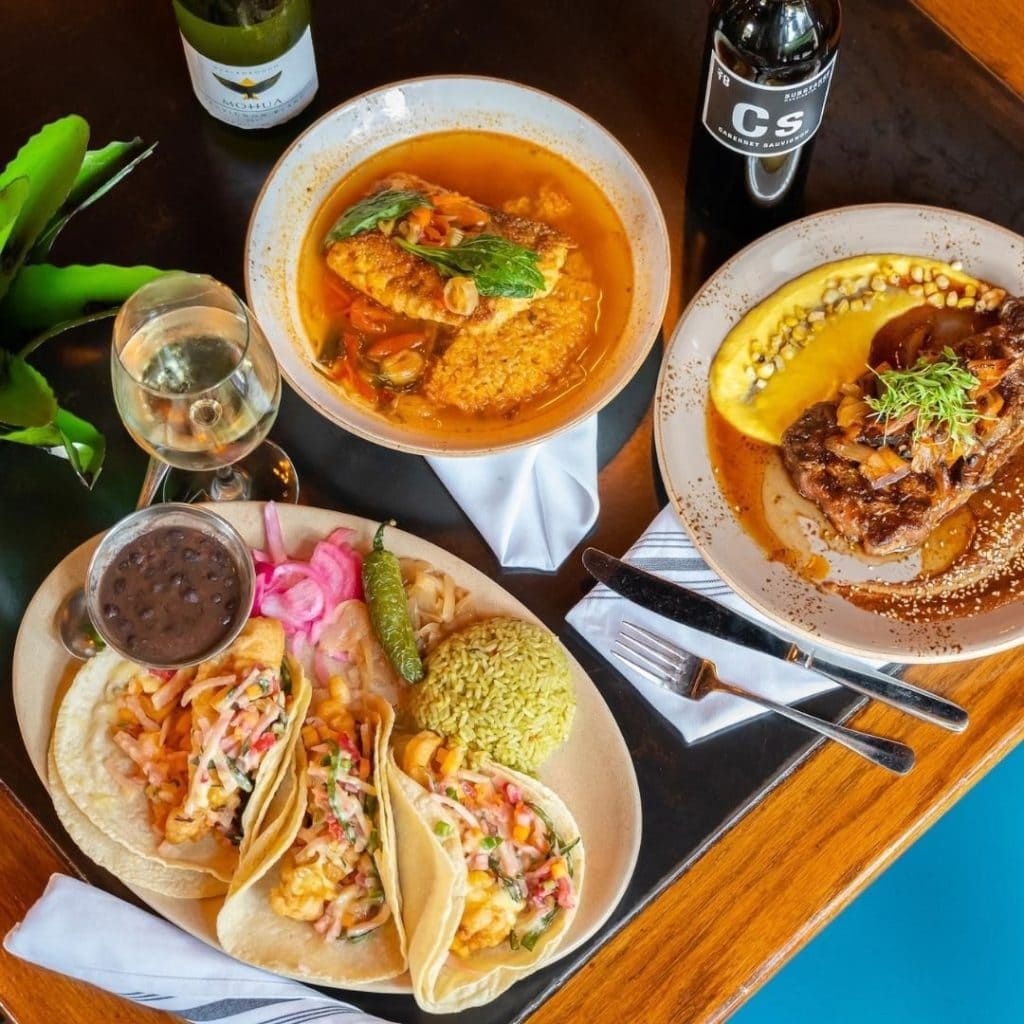 A flavorful spread at La Cosecha featuring Snapper a la Plancha, New York Strip, and Snapper Baja tacos. Credit: @lacosechamexicantable via Instagram