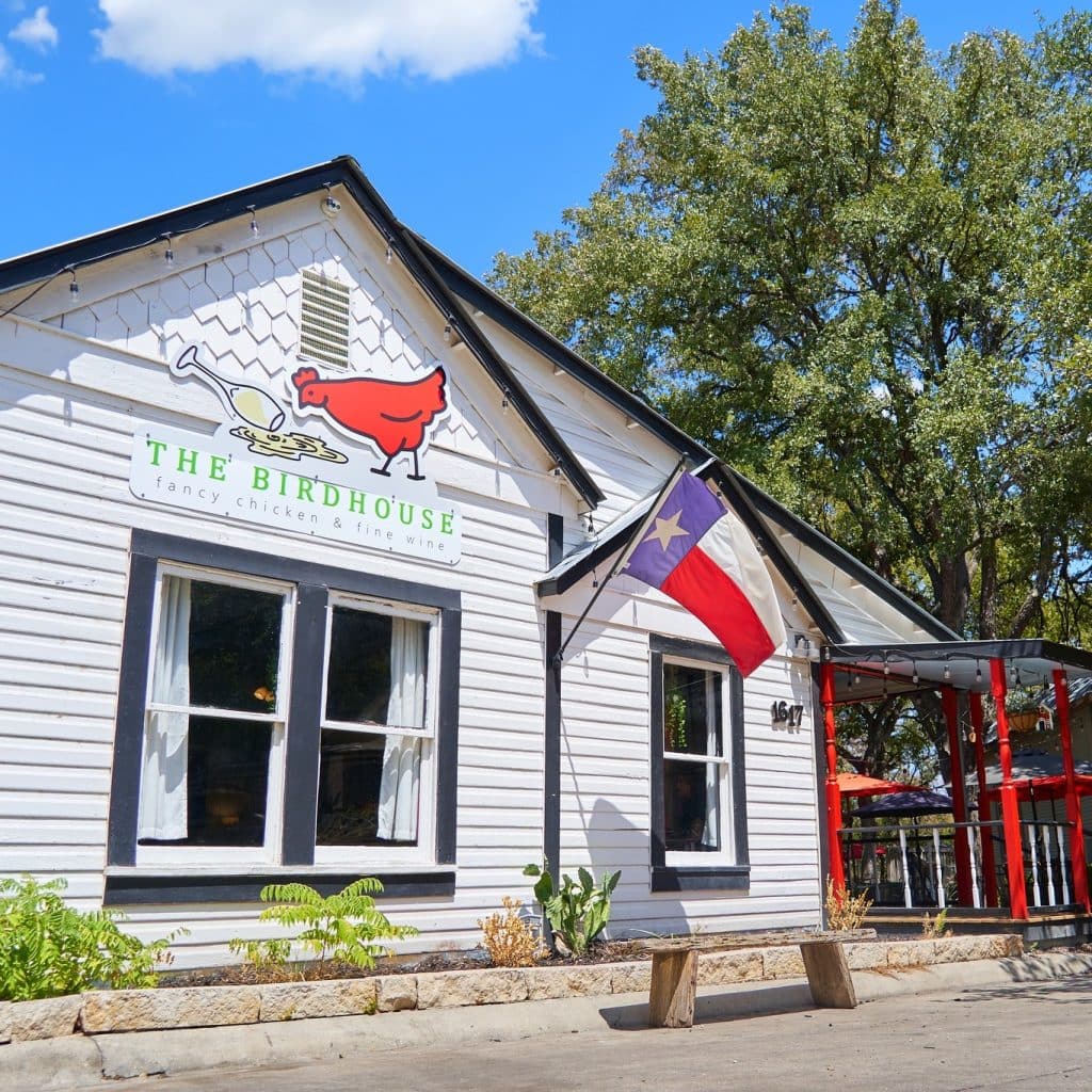 The Birdhouse welcomes guests with a relaxed facade and outdoor patio dining. Credit: @gruenetx via Instagram