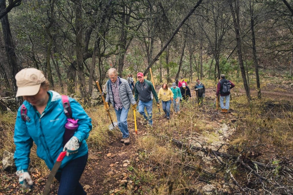 Members of a trail club hiking Panther Canyon Trail, enjoying both fitness and nature. Credit: @comal_trails_alliance via Instagram