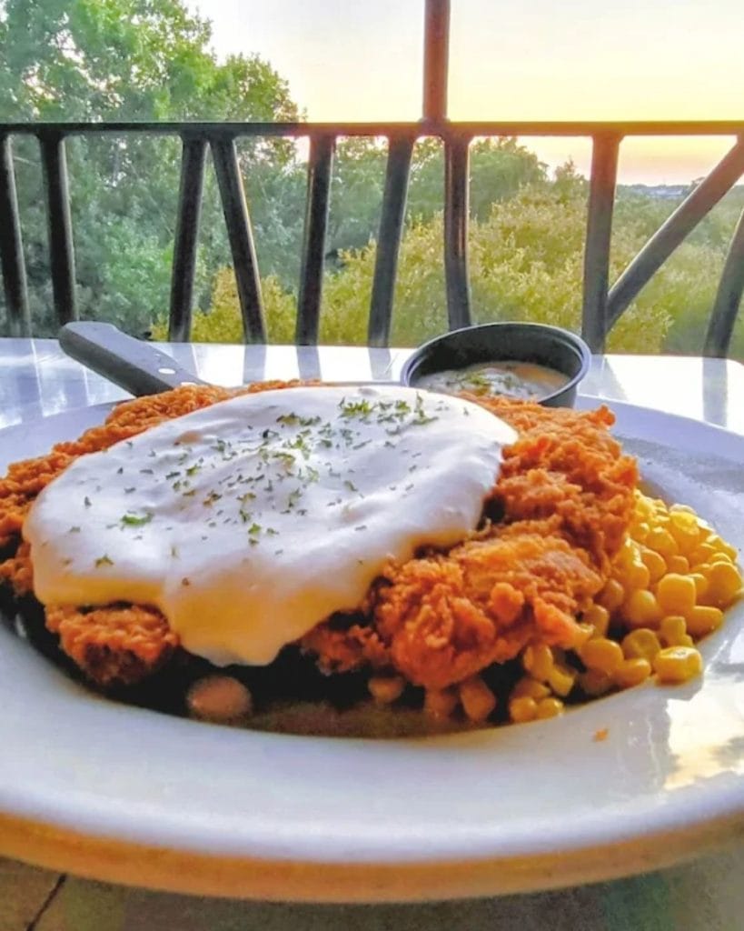 Classic chicken fried steak at Gruene River Grill, served with a scenic view of the Guadalupe River. Credit: @gruenerivergrill via Instagram