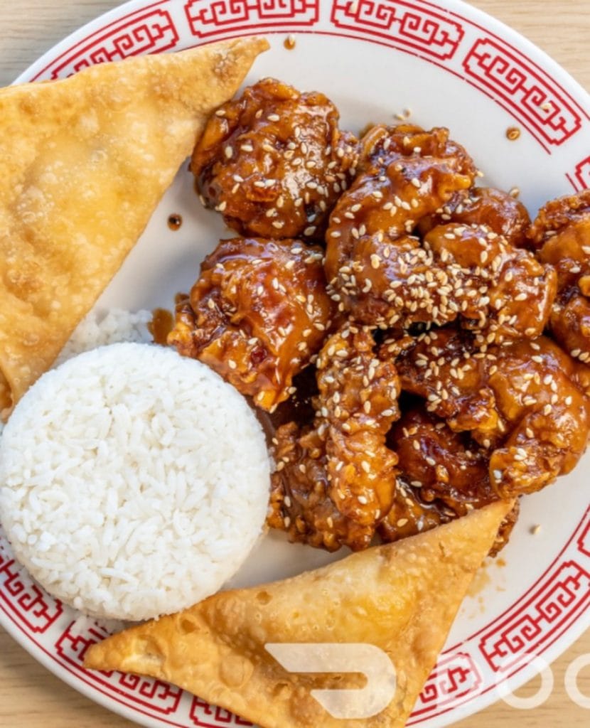 Crispy, saucy, sweet, and sour chicken served fresh at Happy Dragon. Credit: @happydragonnb via Instagram