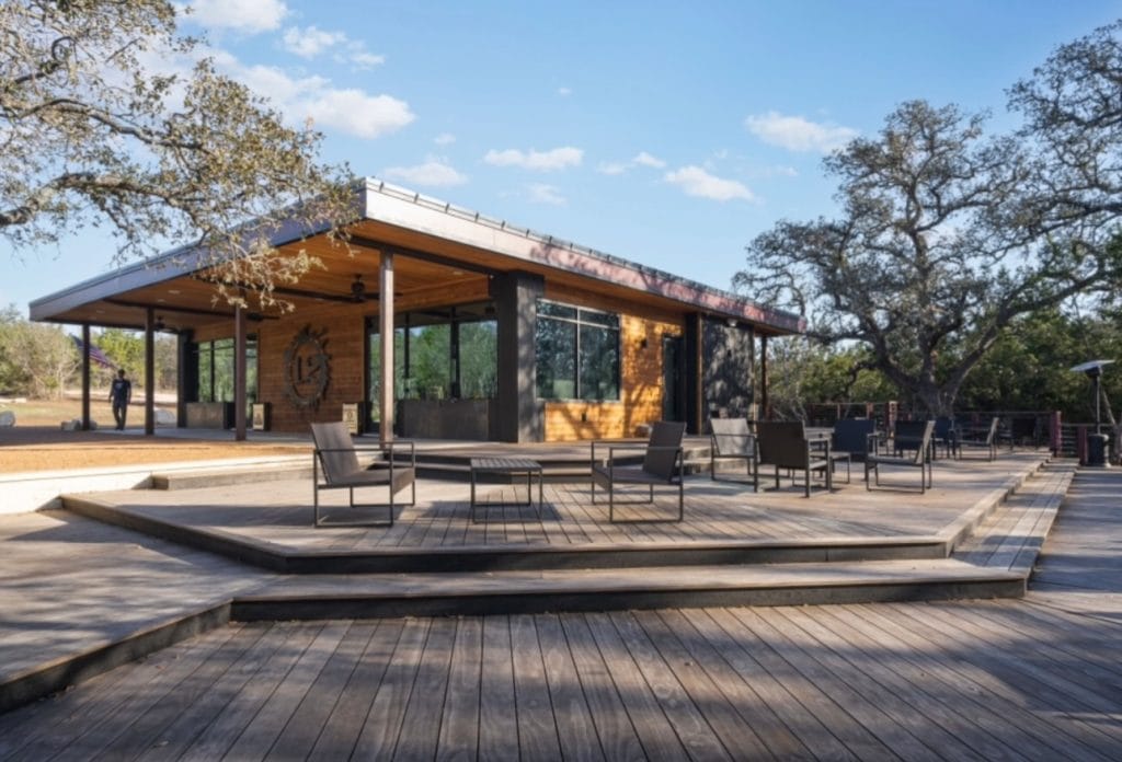 Guests relax on the patio of 12 Fires Winery & Vineyard, enjoying scenic views and fine wine. Credit: @12fireswinery via Instagram