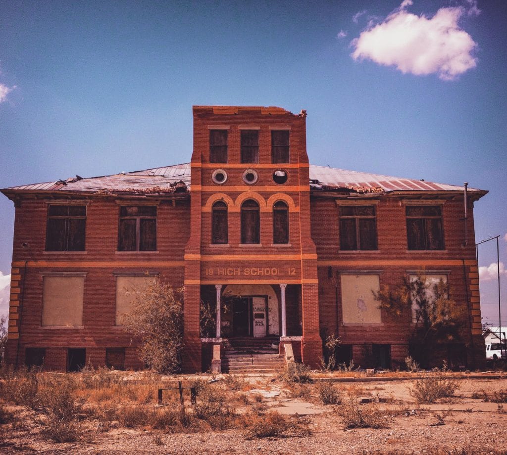 Toyah’s abandoned high school: a quiet relic swallowed by time and the desert wind.