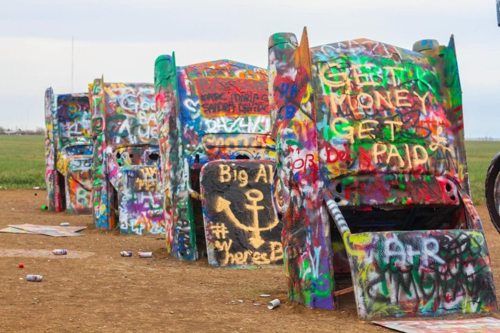 A symbol of Route 66 culture, Cadillac Ranch invites travelers to leave their mark on this ever-changing piece of public art. Credit: @dantemoon via Instagram