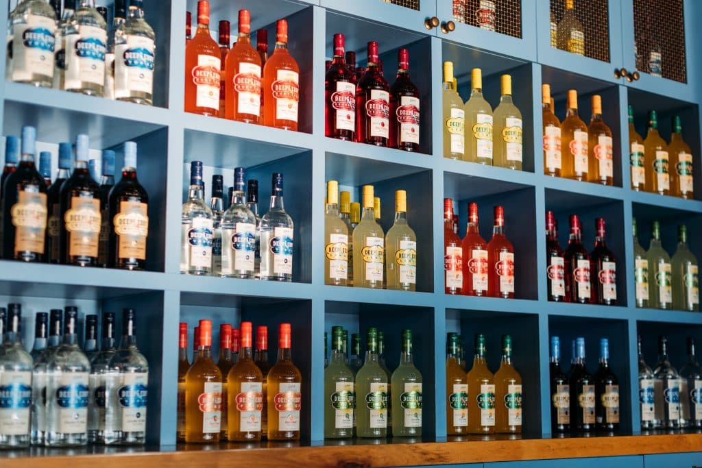 A colorful lineup of Deep Eddy Vodka bottles showcases the craftsmanship of this iconic Dripping Springs distillery. Credit: @deepeddyvodkatastingroom via Instagram