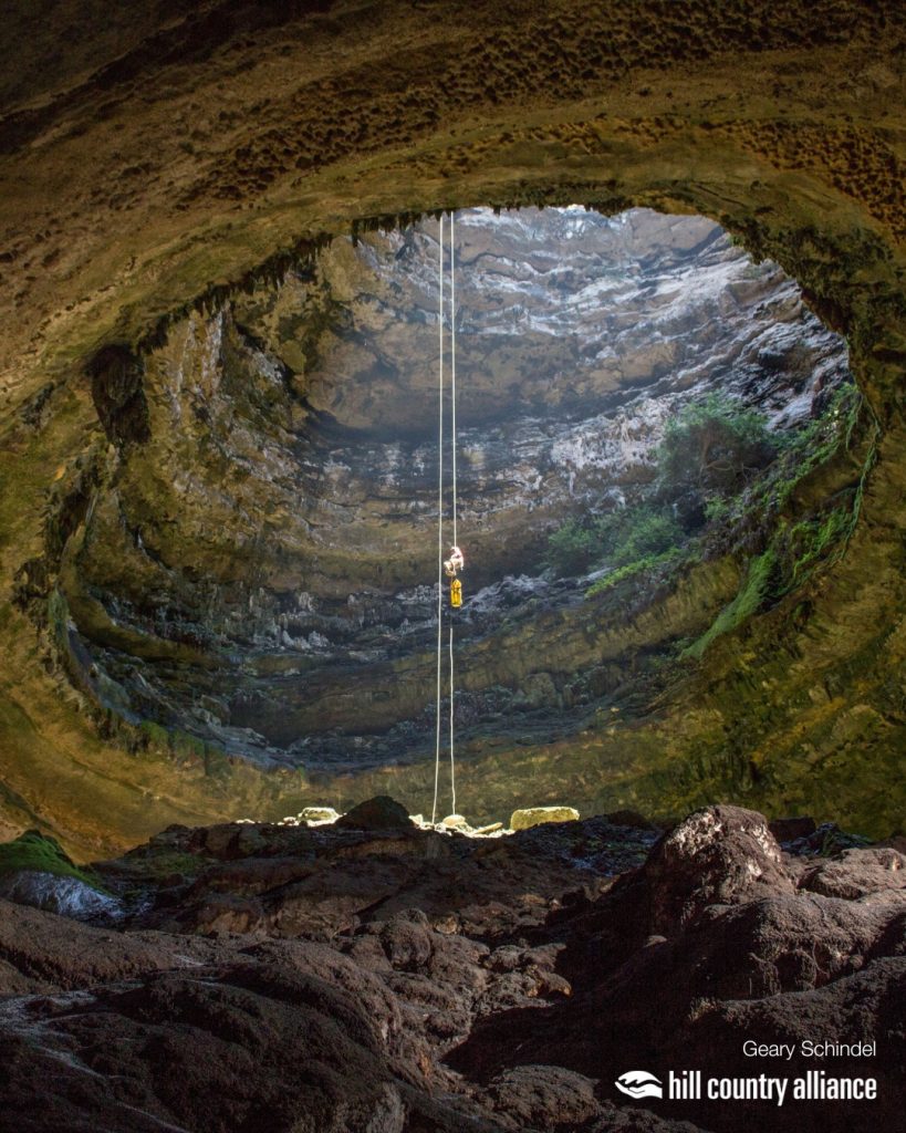 Looking up from inside Devil’s Sinkhole showcases its dramatic depth and eerie beauty. Credit: @hillcountryalliance via Instagram