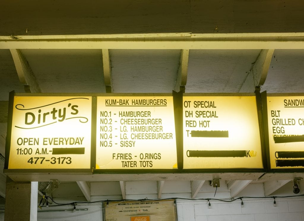 Dirty Martin’s Place keeps it classic: a simple menu beneath the storefront sign, just like generations have seen. Credit: @dirtymartins via Instagram