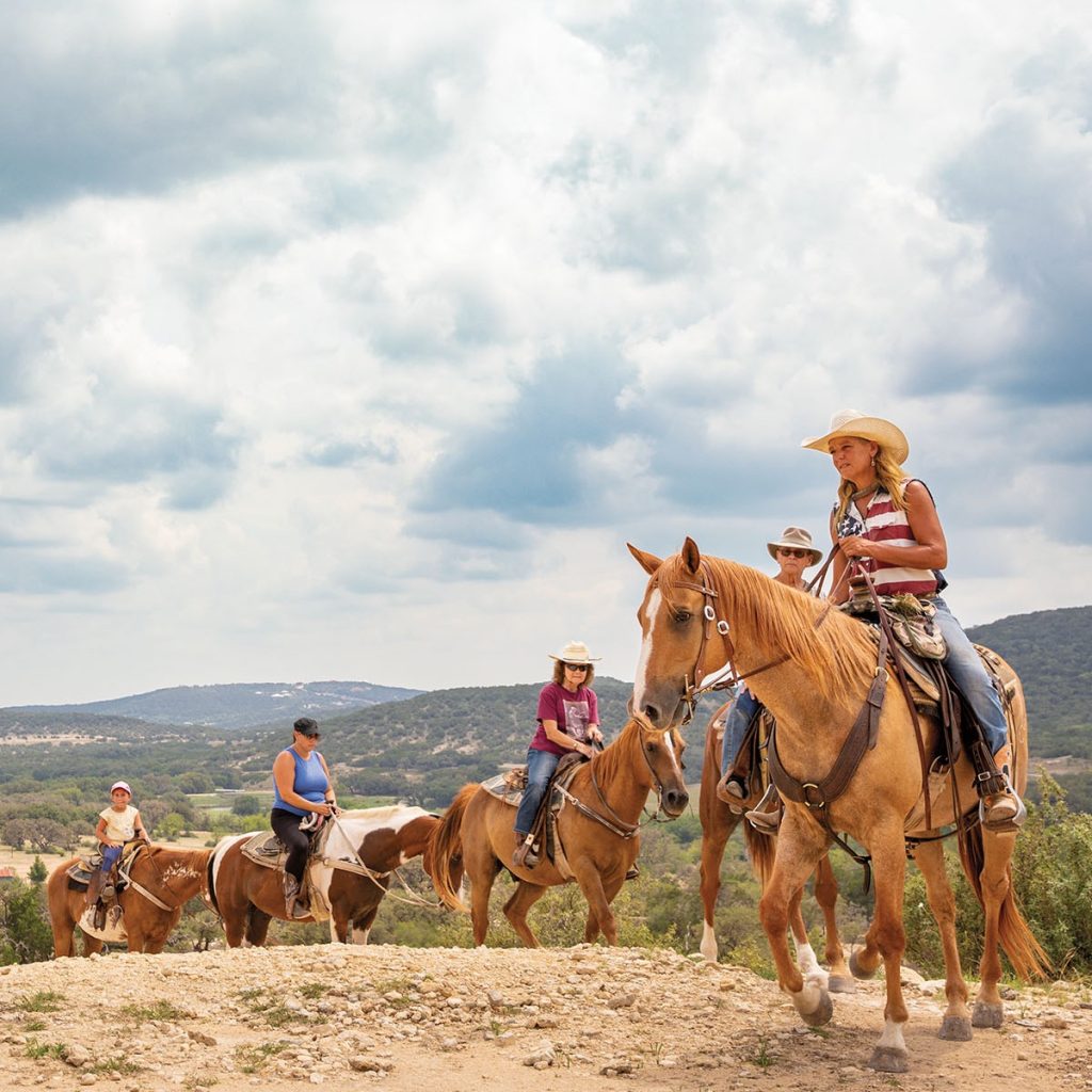 Tourists enjoy a classic Texas experience, horseback riding at Dixie Dude Ranch in Bandera. Credit: @gotexan via Instagram