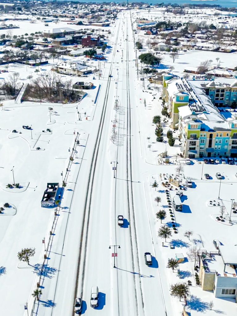 Snow-covered rooftops stretch across Little Elm, capturing the scale of this fast-growing community. Credit: @littleelmtx via Instagram