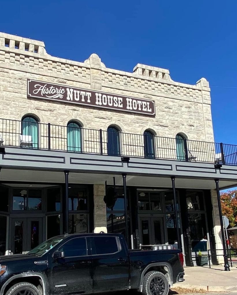 The historic Nutt House Hotel welcomes visitors with its classic limestone facade and small-town Granbury charm. Credit: @ftwtoday via Instagram