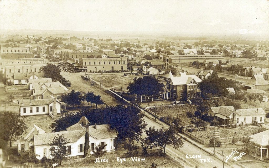 Downtown Elgin around 1915—tree-lined streets, homes with yards, and a slower Texas pace captured in black and white. Credit: @traces_of_texas via Instagram