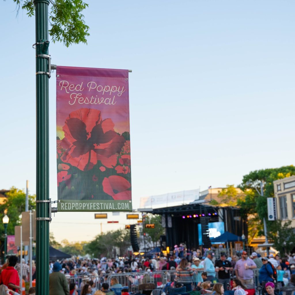 Georgetown’s streets burst into color during the Red Poppy Festival, with crowds, music, and blooms creating a lively small-town celebration. Credit: @visitgeorgetowntx via Instagram