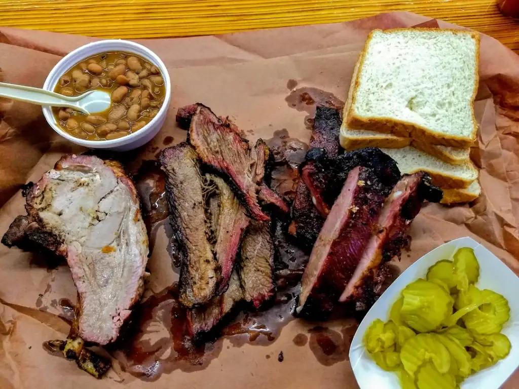 Smitty’s Market BBQ: prime rib, brisket, beans, bread, and pickles—simple, classic, unforgettable. Credit: u/bigbabyjesus76 via r/BBQ