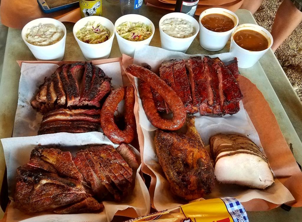 Snow’s BBQ, voted #1 in Texas, offers a VIP spread of sausage, brisket, ham, and classic sides. Credit: u/mike_hfd via r/BBQ
