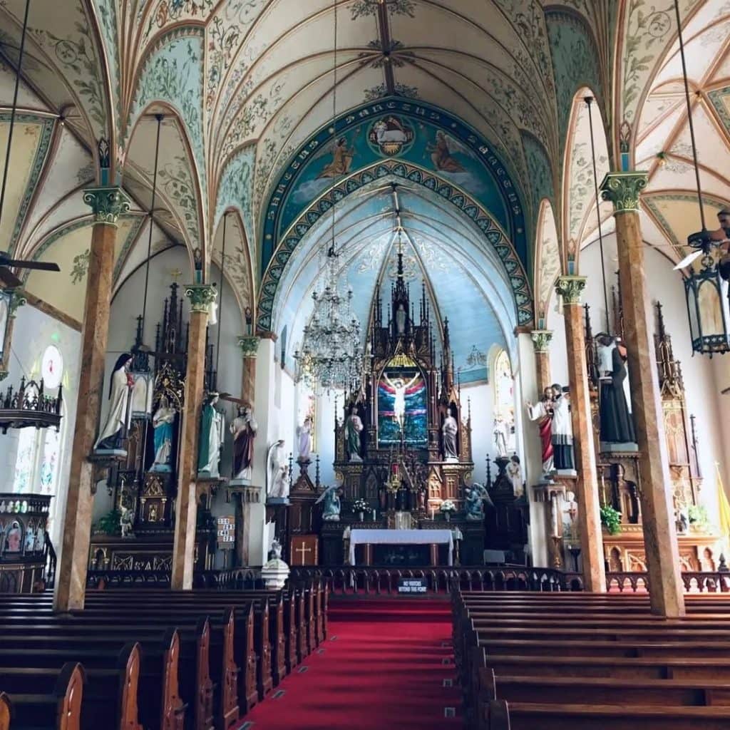 Inside St. Mary’s Church in High Hill, hand-painted columns are crafted to resemble marble, creating a beautifully ornate interior. Credit: @americacatholicphotography via Instagram