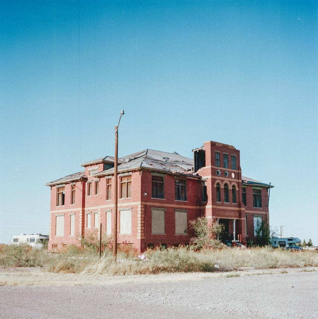 The abandoned Toyah High School stands as one of the few remaining structures after the 2004 tornado, with local lore adding eerie tales of “black-eyed children” to the town’s history. Credit: @pokismash via Instagram