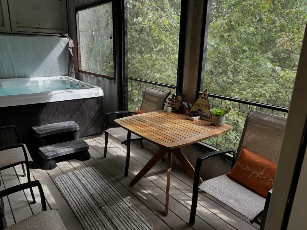 Your very own hot tub inside the Air Castle. Soak, relax, and nature-watch without ever stepping outside. Credit: @highpointtreehouses via Instagram