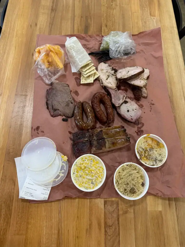A BBQ spread from Kreuz Market—no sauce, which isn’t for everyone. A local even pointed out that the sausage looks "greasy as hell". Credit: u/SmokeMeatEveryday88 via r/BBQ