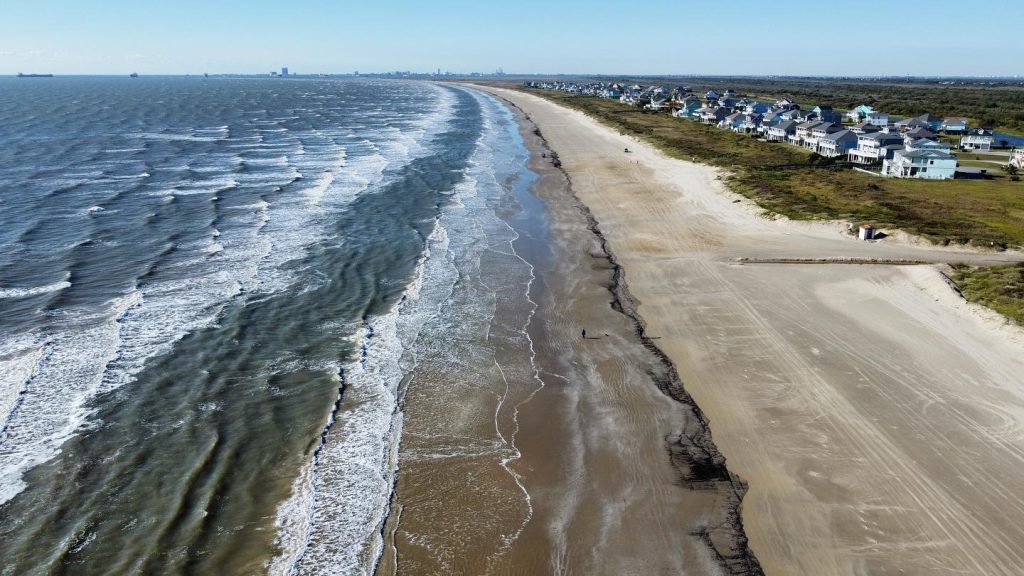 An aerial view of Crystal Beach, revealing its vast shoreline and plenty of open space to explore. Credit: @black_pearl_crystal_beach via Instagram
