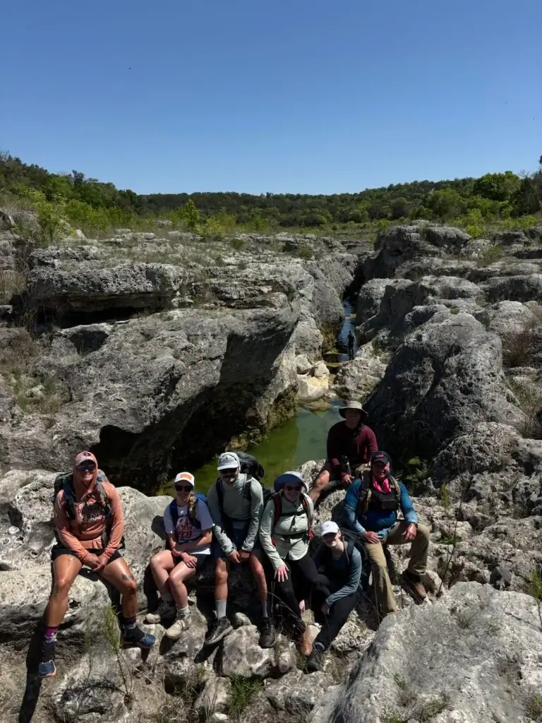 A group of hikers taking on the rocky, challenging trail to reach the Blanco River Narrows—worth every step. Credit: u/19TowerGirl89 via r/CampingandHiking