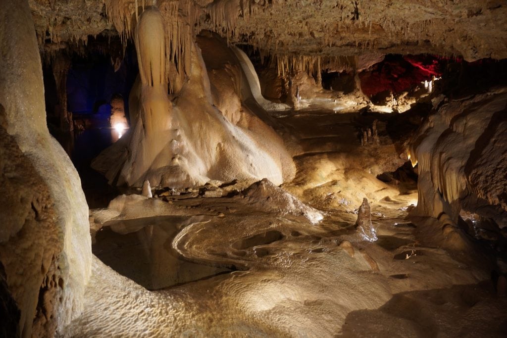 A breathtaking look inside Inner Space Cavern, highlighting the crescent-shaped Lake of the Moon glowing beneath the cave ceiling. Credit: @innerspacecavern via Instagram