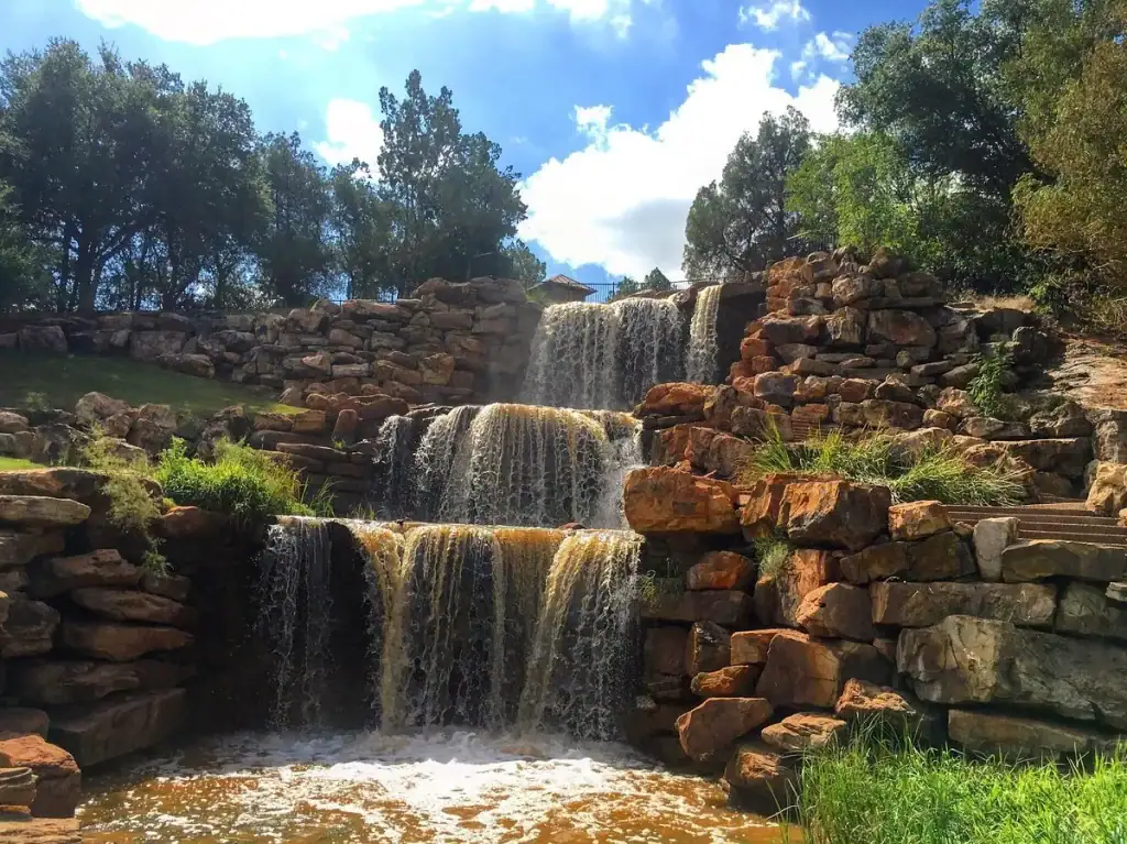 The 54-foot man-made waterfall at Lucy Park — a relaxing green escape right in Wichita Falls. Credit: Marley Pearce