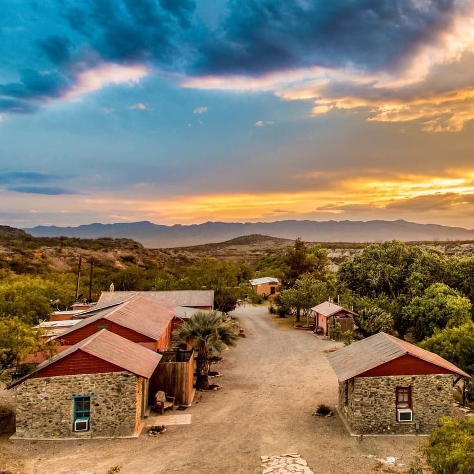 Aerial view of Chinati Hot Springs—a serene desert retreat with cabins and full amenities for a comfortable stay. Credit: @chinatihotsprings via Instagram
