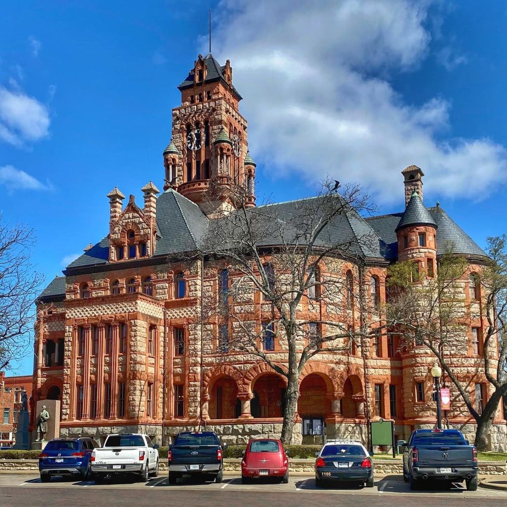 The Ellis County Courthouse is one of the most photographed structures in Texas, admired for its intricate details and striking architecture. Credit: @discoveringgtx via Instagram