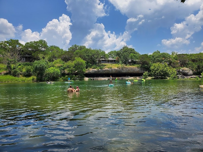 View of the Cypress Falls Swimming Hole—cool, spring-fed waters perfect for beating the Texas heat. Credit: @thelodgeatcypressfalls via Instagram