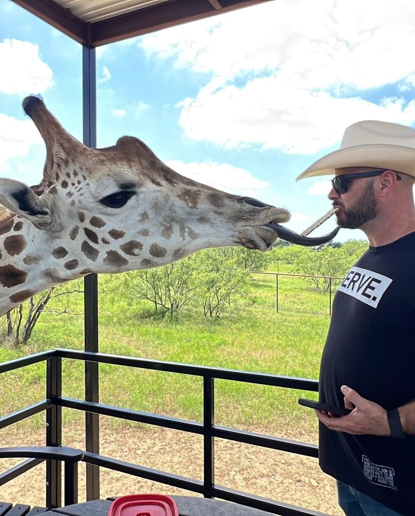 Dining with giraffes at Blue Hills Ranch—an unforgettable experience where wildlife and hospitality meet. Credit: @kariborgman via Instagram