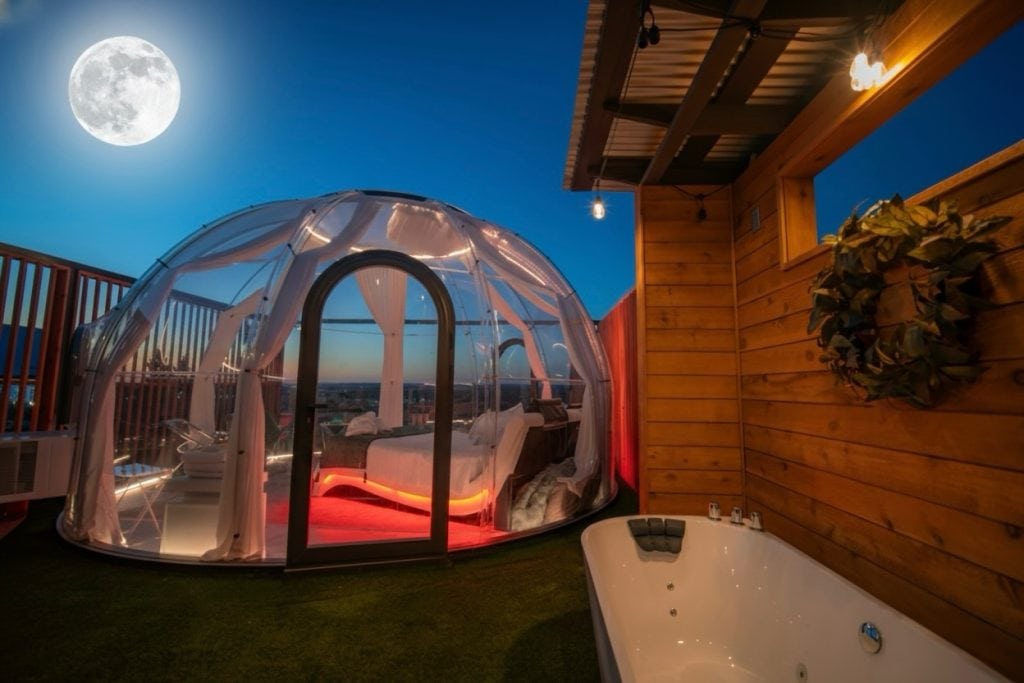 The Star Dome cabin at The Retreat on the Hill features a transparent dome with modern amenities and an outdoor bathtub—designed for immersive nature stays and stargazing. Credit: @theretreatonthehill via Instagram