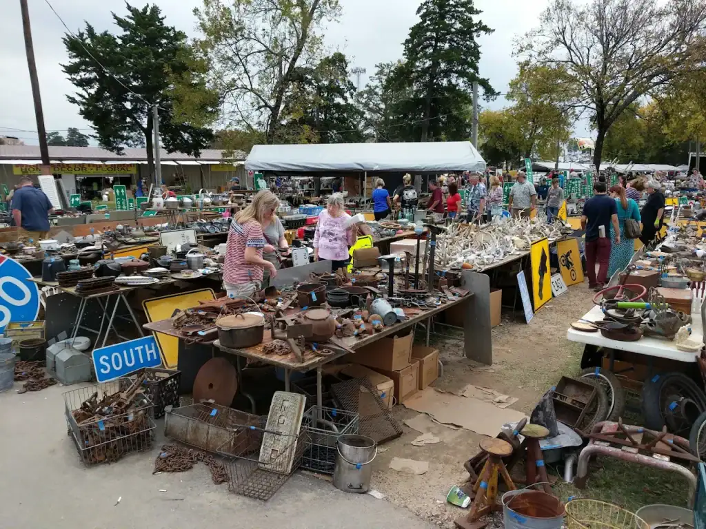 Rows upon rows of vendor tables at First Monday Trade Days — antiques, secondhand finds, crafts, and just about anything you didn’t know you needed. It truly feels like treasure hunting on a massive scale. Credit: Chris Brooks