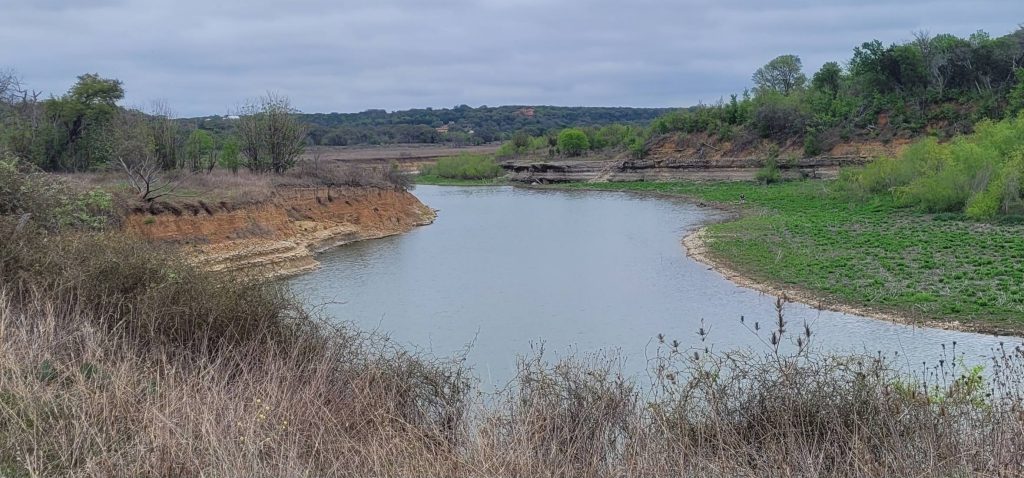Lake Georgetown as seen while hiking and camping along the Good Water Loop—calm waters paired with endless sky. Credit: Aiden O'driscoll via Facebook