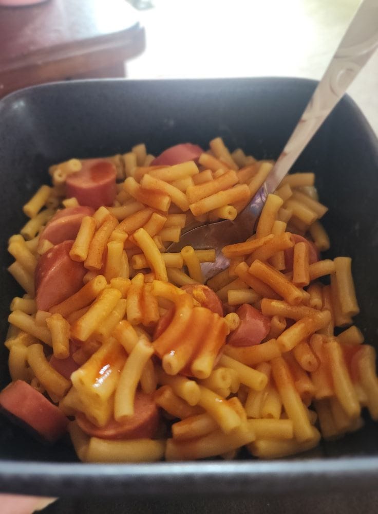 A bowl of boxed Kraft mac and cheese with hot dogs… and hot sauce, obviously. Very Texas behavior. Credit: Kathy Jo via Facebook
