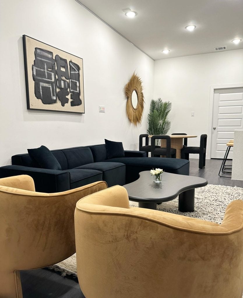 A cozy, boho-themed living room in a Houston loft Airbnb—stylish, comfortable, and ideal for post-match downtime. Credit: @cassidyckay via Instagram