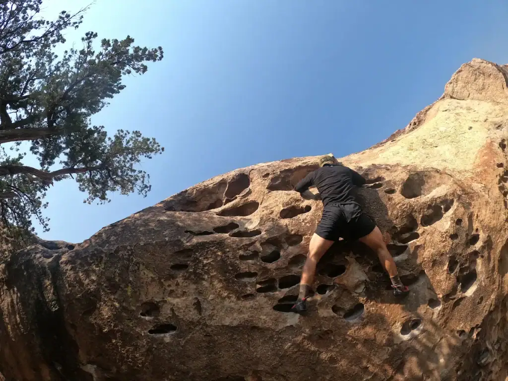 A climber scales the rugged rocks at Hueco, showcasing the park’s adventurous spirit. Credit: Pámela Bóveda-Aguirre