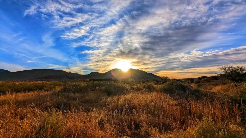 Sunrise at Hueco Tanks paints the landscape in breathtaking light, a moment of pure desert beauty. Credit: Nguyen Le