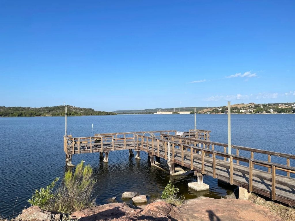 A wooden boardwalk stretches into the lake, offering a quiet place to sit, fish, and enjoy the view. Credit: BradinHK