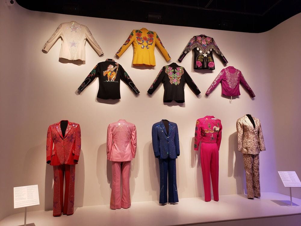 Sparkling cowgirl suits highlight the stylish side of rodeo life, proving women rode in true western fashion. Credit: Clarice C.