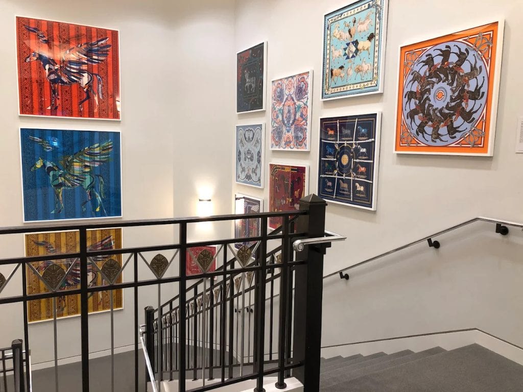 Horse-themed paintings decorate the museum walls, adding artistic depth to the western narrative. Credit: Debra Caffey